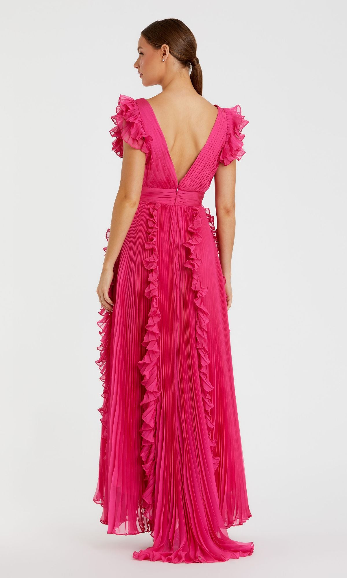 Woman wearing the Mac Duggal Ruffle-Sleeve Long Formal Dress 49539 in bright pink, featuring floor-length pleats, ruffled short sleeves, and ruffle trim, facing away and looking to the side.